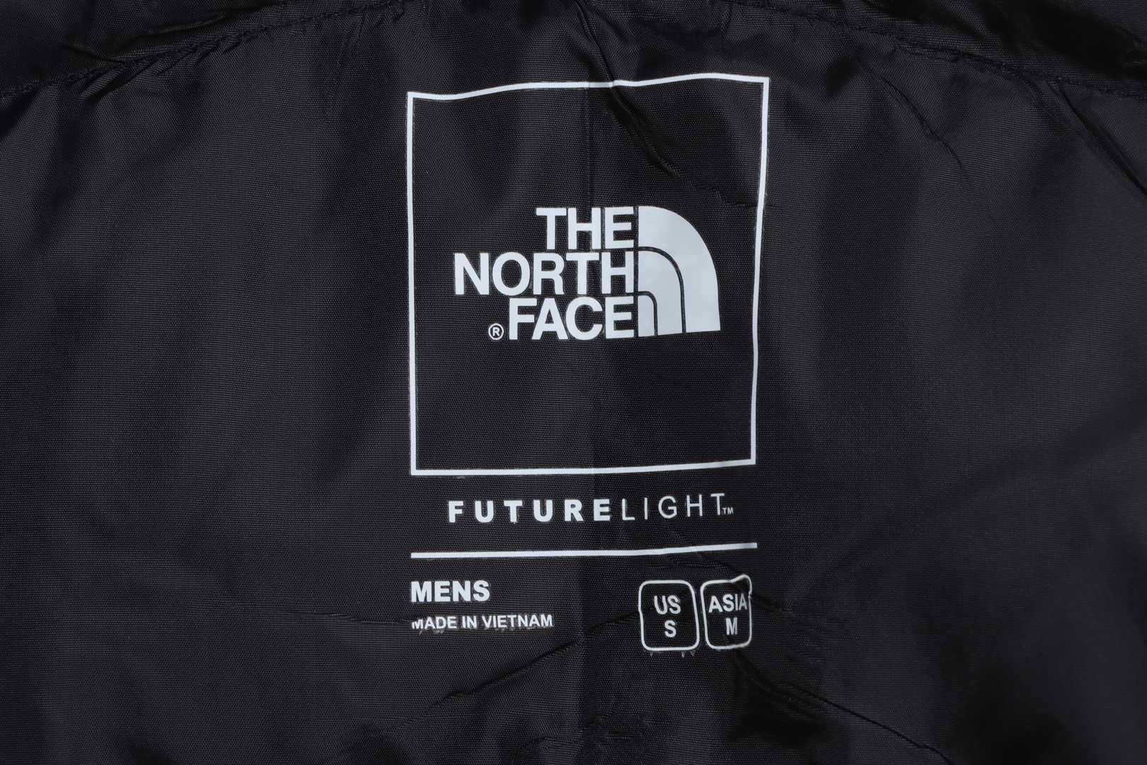the n0*h F**e chest patch micro label down vest