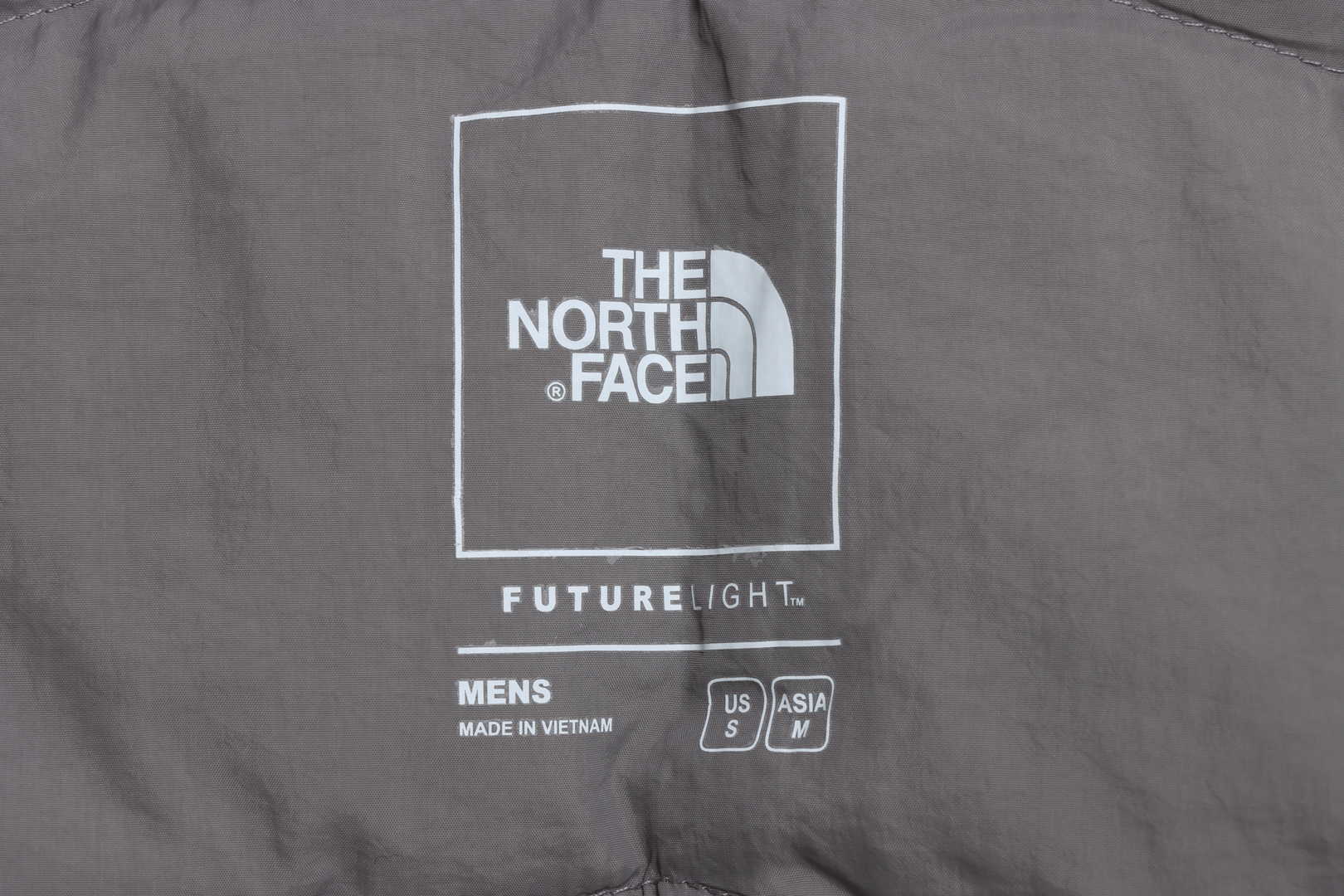the n0*h F**e chest patch micro label down vest